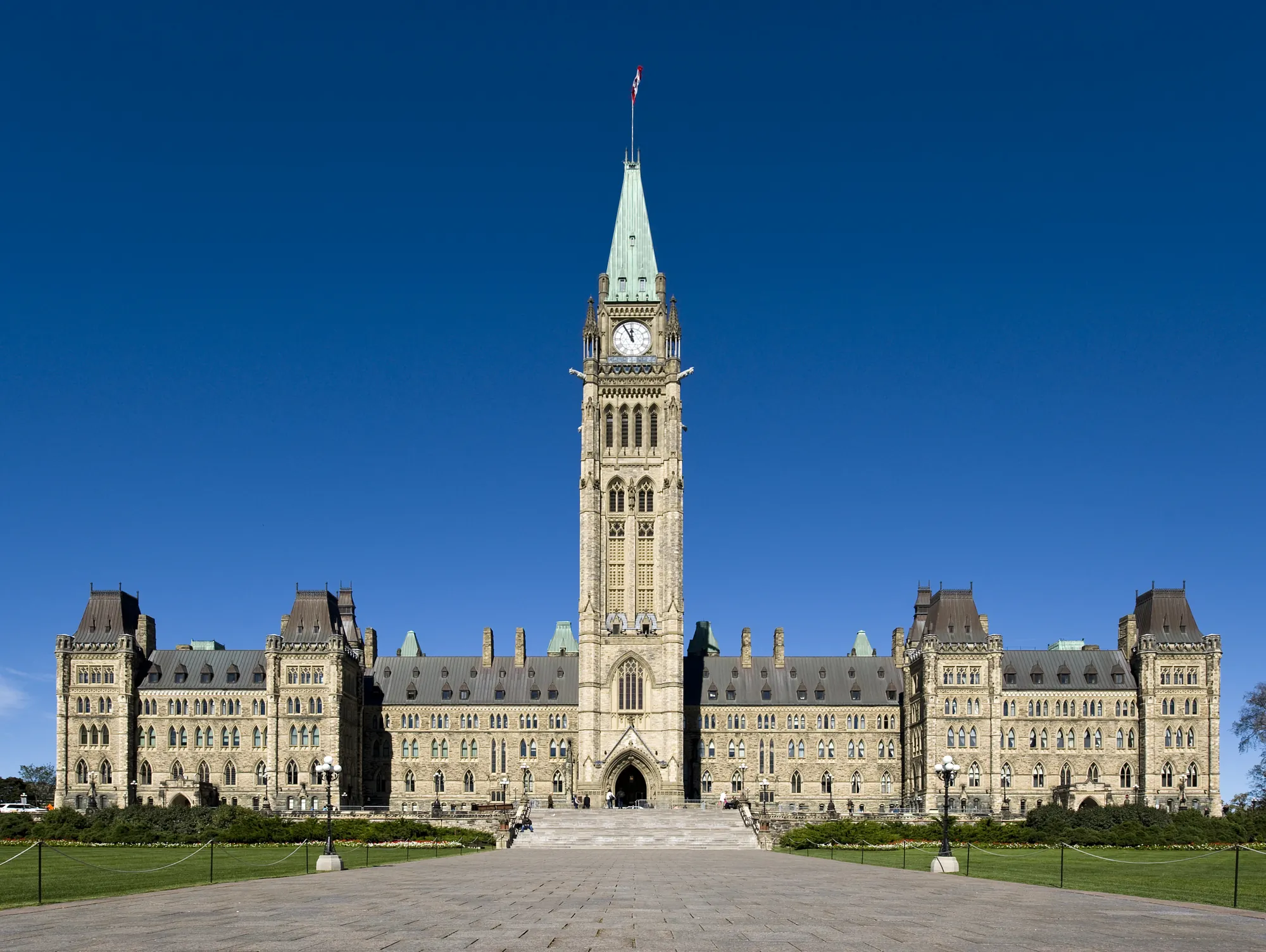Centre Block and the Peace Tower on Parliament Hill, Ottawa, seen across the front lawn.